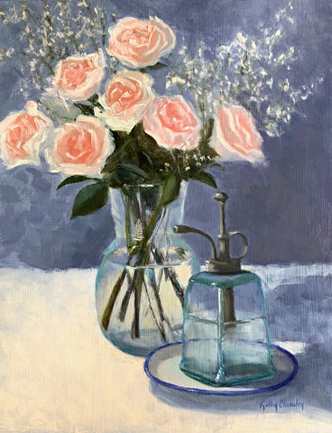 Still life painting of pink roses with baby's breath in a glass vase on white tabletop with a blue background and plant mister in the foreground by Kathy Chumley at Cottage Curator - Sperryville VA Art Gallery