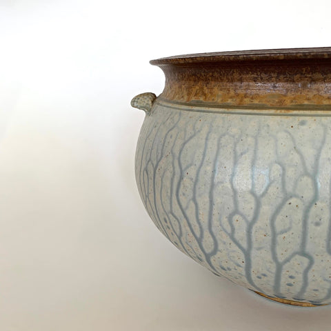 Detail of stoneware planter with white and gray glazed body and brown top edge and handles by Richard Aerni at Cottage Curator - Sperryville VA Art Gallery