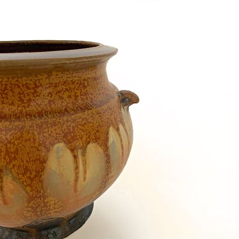 Detail of one side of a vessel with wide mouth and two handles glazed in ochre and gray with a dark brown interior by Richard Aerni at Cottage Curator - Sperryville VA Art Gallery