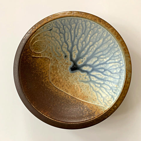 Stoneware wall platter with brown and blue/gray glazing and raised spiral design by Richard Aerni at Cottage Curator - Sperryville VA Art Gallery