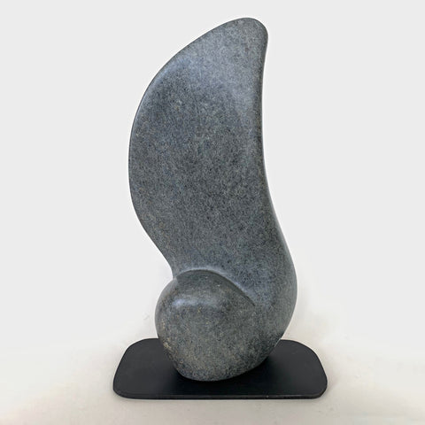 Gray Soapstone sculpture with black base in the shape of a large rounded feather or wing by Robert Bouquet at Cottage Curator - Sperryville VA Art Gallery