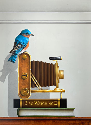 Realistic acrylic painting of Eastern Bluebird sitting on top of old-fashioned accordion camera atop two books, one labelled Bird Watching II by James Carter at Cottage Curator - Sperryville VA Art Gallery