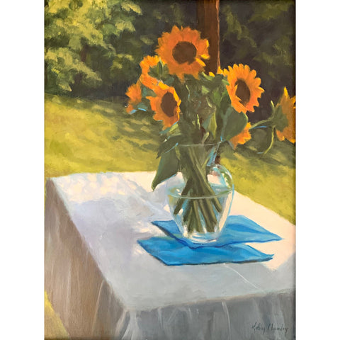 Still life with vase of sunflowers on a table set outdoors with white tablecloth and blue linens by Kathy Chumley at Cottage Curator - Sperryville VA Art Gallery