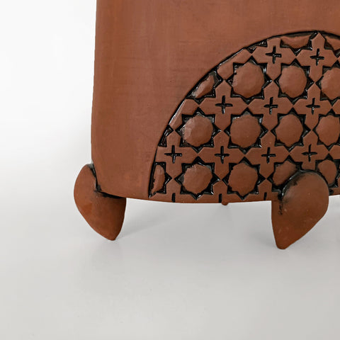 Detail of stoneware vessel in natural tan clay color with handle and carved patterned circles by Yoshi Fujii at Cottage Curator - Sperryville VA Art Gallery