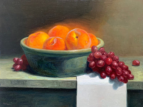 Still life painting of a bowl of golden peaches with red grapes on a tabletop by Vivian Tanga at Cottage Curator - Sperryville VA Art Gallery